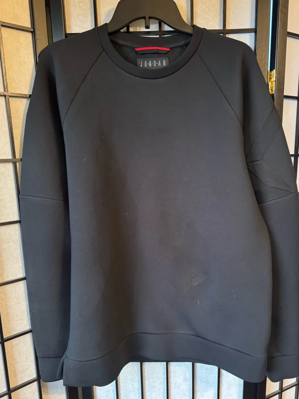Jordan Sportswear Flight Tech Shield Crewneck Sweatshirt in black.